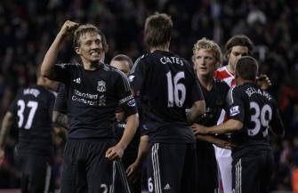 Lucas of Liverpool celebrates with team mates at the end of the match during the Carling Cup Fourth Round match between Stoke City and Liverpool